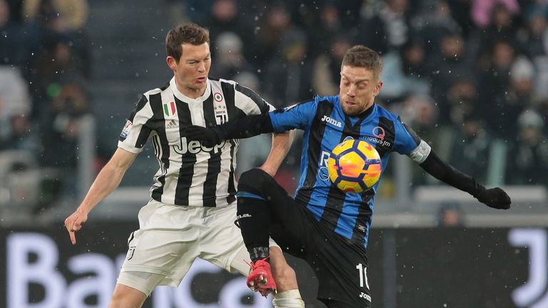 Alejandro Gomez (R) challenged by Stephan Lichtsteiner