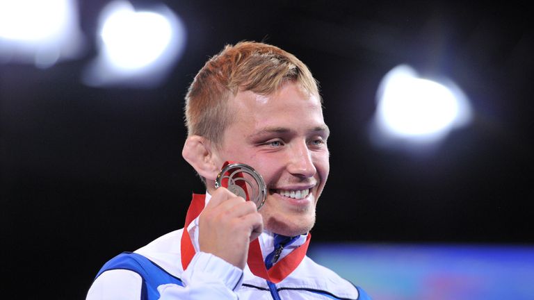 Silver medalist Alex Gladkov of Scotland poses with his medal after the Men's Freestyle 65kg Freestyle Wrestling Gold medal match at the SECC, 2014 Commonw