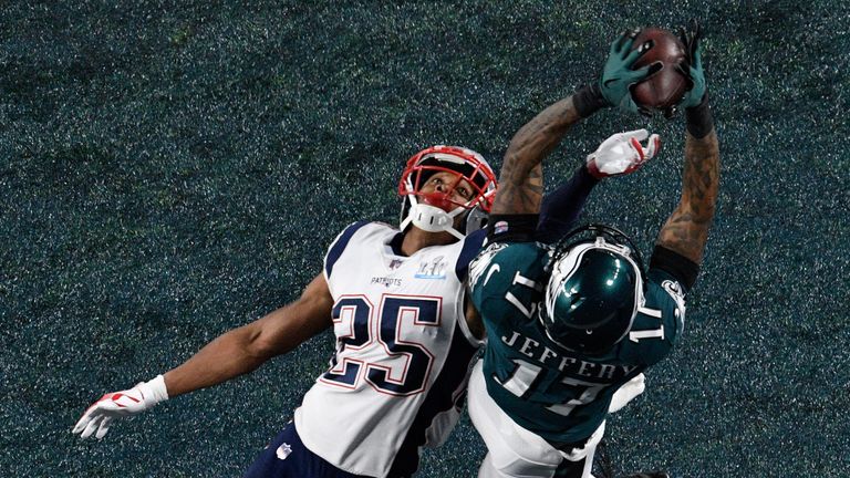 Alshon Jeffery #17 of the Philadelphia Eagles catches a 34-yard touchdown pass over Eric Rowe #25 of the New England Patriots