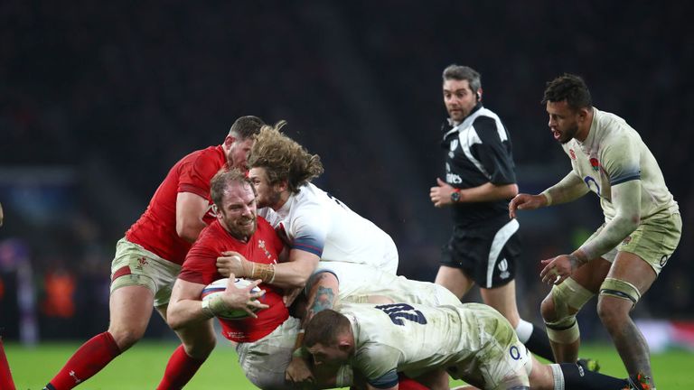 Alun Wyn Jones is tackled by Sam Underhill of England during the Six Nations match between England and Wales at Twickenham