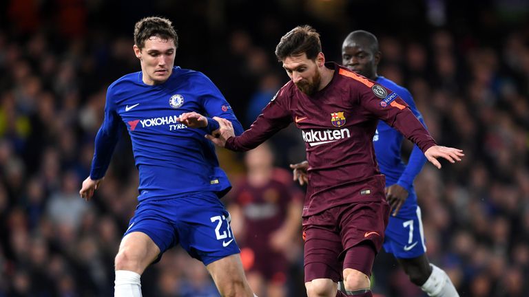 Lionel Messi of Barcelona runs with the ball under pressure from Andreas Christensen of Chelsea during the UEFA Champions League tie