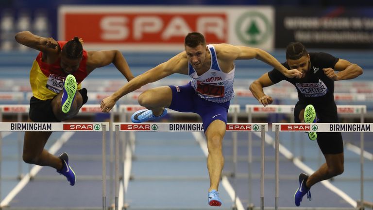 Andrew Pozzi (centre) storms to victory at the GB Indoor Championships in Birmingham