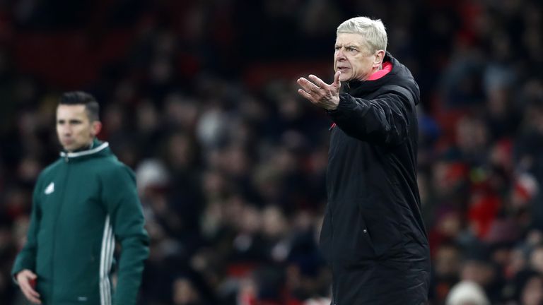 Arsenal's French manager Arsene Wenger gestures on the touchline during the second leg of the Europa League Round of 32 football match between Arsenal and 