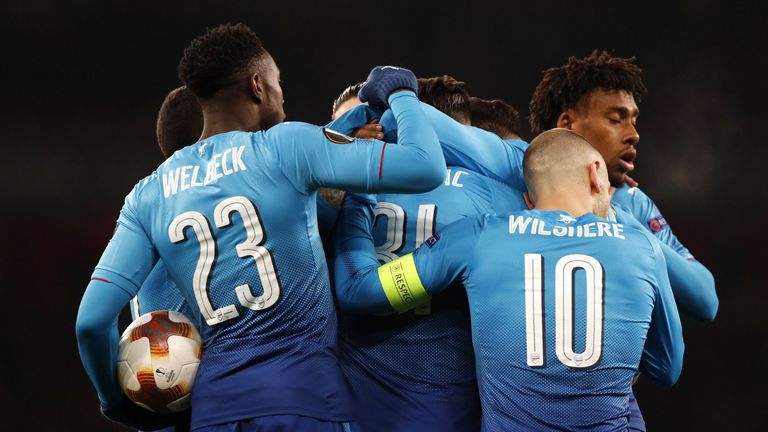 Arsenal's German-born Bosnian defender Sead Kolasinac (C) celebrates with teammates after scoring their first goal during the second leg of the Europa Leag