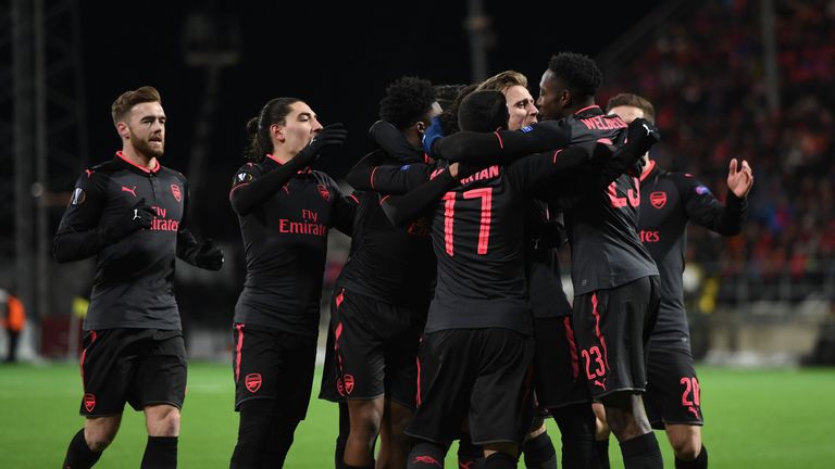 Arsenal players celebrate after scoring against Ostersunds