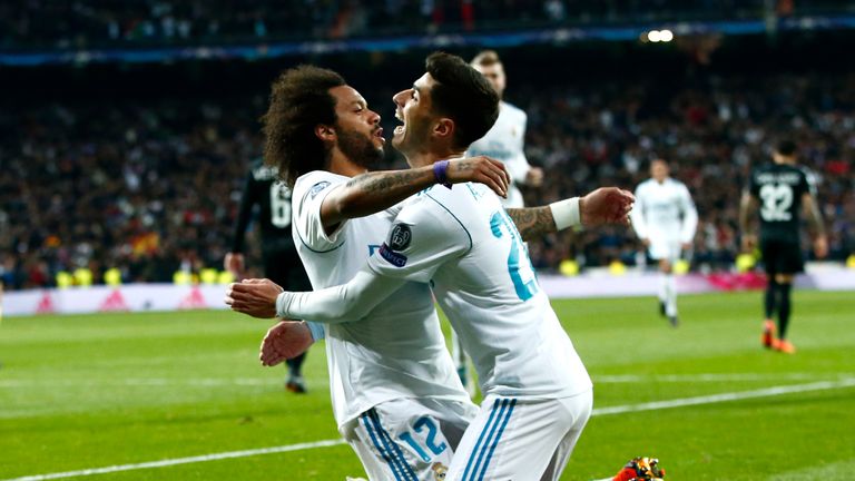 MADRID, SPAIN - FEBRUARY 14:  Marcelo of Real Madrid celebrates scoring the 3rd Real Madrid goal with Marco Asensio of Real Madrid during the UEFA Champion