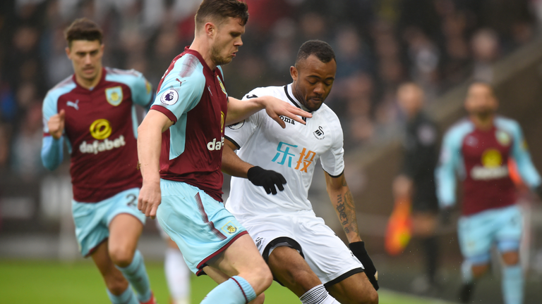 Jordan Ayew challenges for the ball
