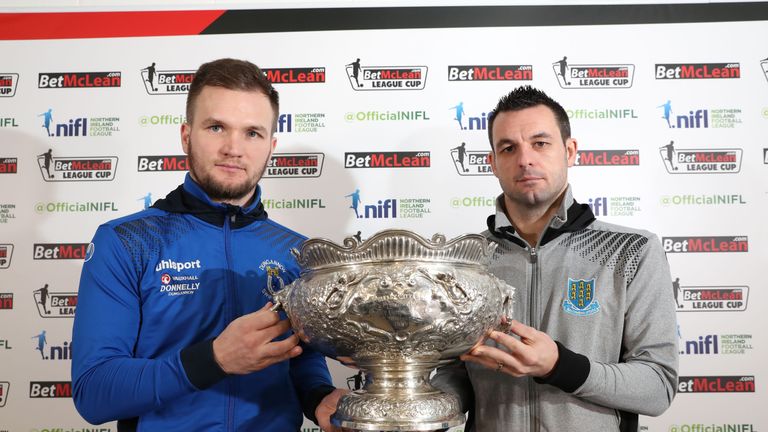 Dungannon Swifts captain Ryan Harpur and Ballymena United captain Jim Ervin with the League Cup (Image: Press Eye)