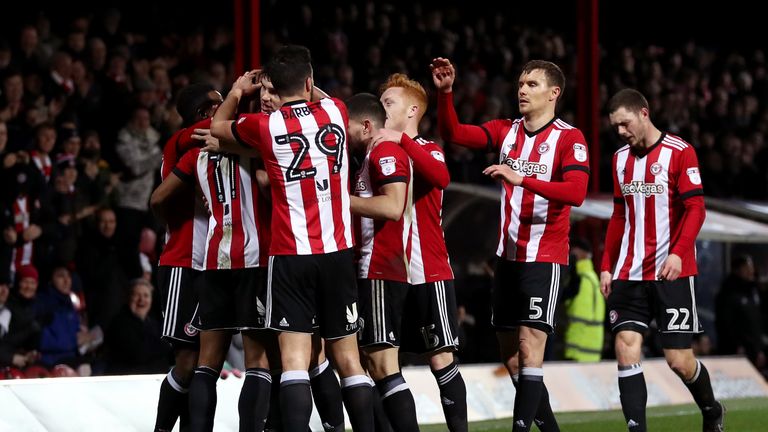 BRENTFORD, ENGLAND - FEBRUARY 20:  Ollie Watkins of Brentford celebrates with teammates  after scoring the first Brentford goal during the Sky Bet Champion