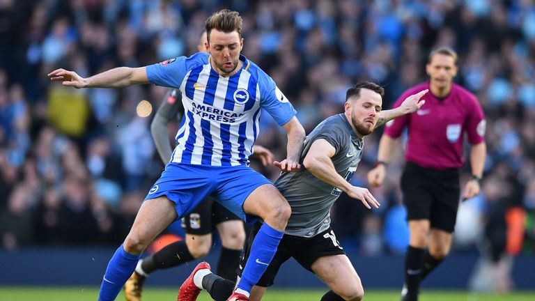 Brighton's English midfielder Dale Stephens (L) vies with Coventry City's Scottish striker Marc McNulty