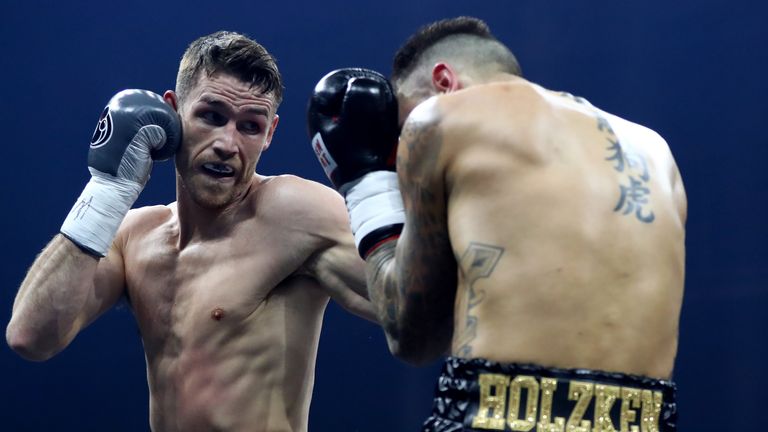 Callum Smith (left) gets stuck into Nieky Holzken in Germany on Saturday night