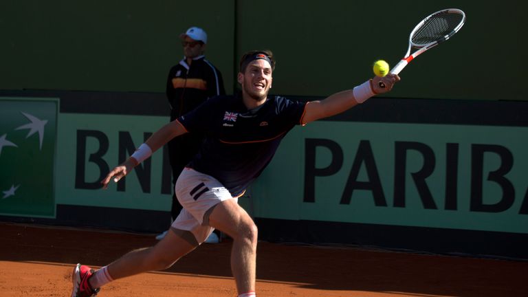 British Cameron Norrie returns the ball to Spain's Roberto Bautista during the first round of the Davis Cup tennis match between Spain and Great Britain at