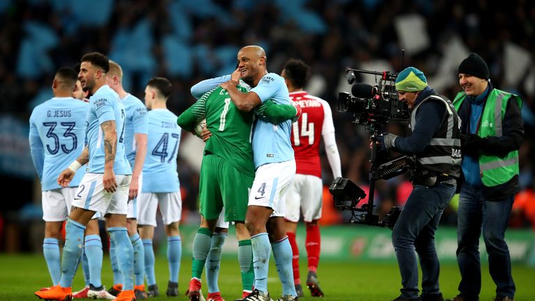 LONDON, ENGLAND - FEBRUARY 25:  Claudio Bravo, and Vincent Kompany of Manchester City celebrate after the Carabao Cup Final between Arsenal and Manchester 
