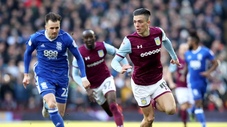 Aston Villa's Jack Grealish and Birmingham City's Carl Jenkinson battle for the ball