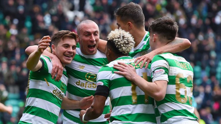 Celtic's James Forrest celebrates completing his hat-trick with team-mates