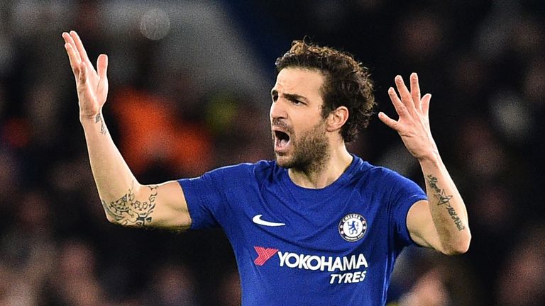 Chelsea's Spanish midfielder Cesc Fabregas gestures to the crowd after Chelsea take the lead during the first leg of the UEFA Champions League round of 16 