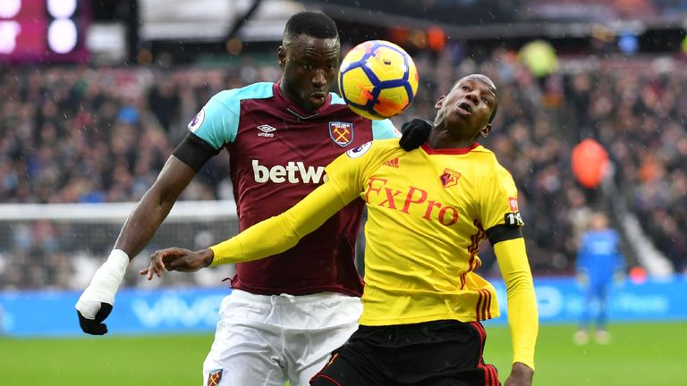 Cheikhou Kouyate challenges Abdoulaye Doucoure for possession