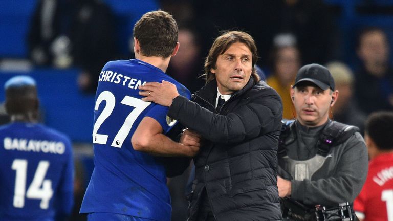 Chelsea's Italian head coach Antonio Conte celebrates on the pitch with Chelsea's Danish defender Andreas Christensen (L) after the English Premier League 