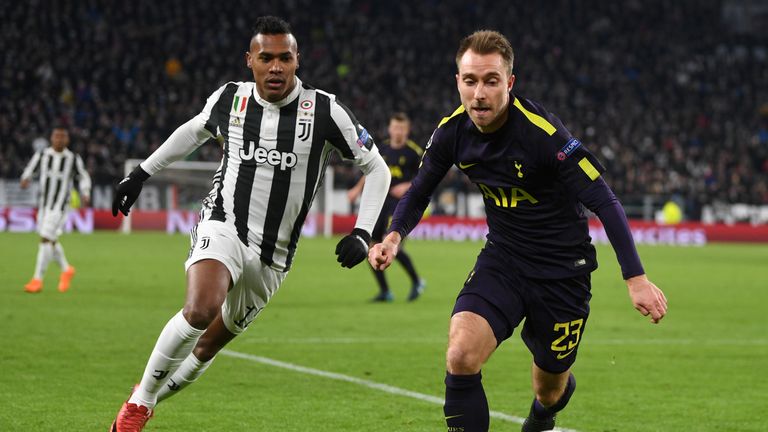 TURIN, ITALY - FEBRUARY 13: Christian Eriksen of Tottenham Hotspur is challenged by Alex Sandro of Juventus during the UEFA Champions League Round of 16 Fi