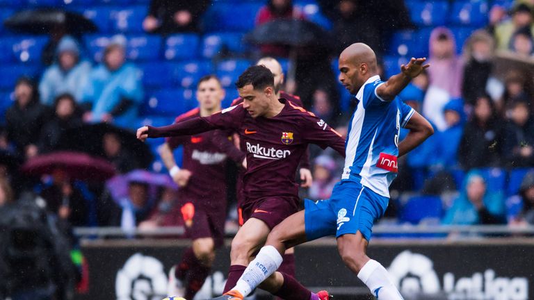 Naldo looks to dispossess Philippe Coutinho during a fiery encounter