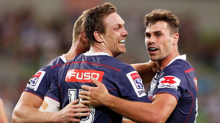 MELBOURNE, AUSTRALIA - FEBRUARY 23:  Dane Haylett-Petty of the Rebels celebrates a try with Tom English of the Rebels during the round two Super Rugby matc