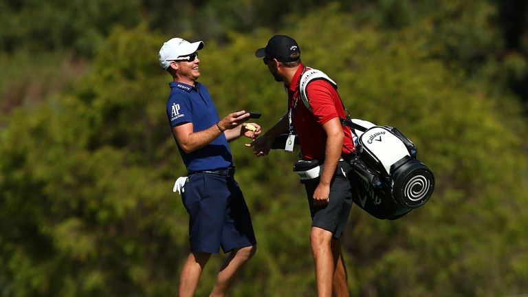 PERTH, AUSTRALIA - FEBRUARY 06:  Danny Willett of England shares a moment with hus caddie before playing his second shot on the 6th hole during a practice 
