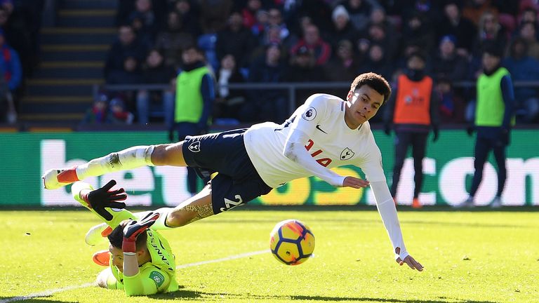 LONDON, ENGLAND - FEBRUARY 25:  Dele Alli of Tottenham Hotspur is challenged by Wayne Hennessey of Crystal Palace during the Premier League match between C
