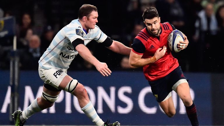 Munster's Irish scrum half Conor Murray (R) tries to breack away from Racing's Irish lock Donnacha Ryan (L) during the European Champions Cup rugby union m