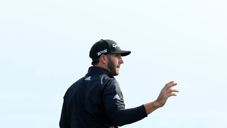 PEBBLE BEACH, CA - FEBRUARY 10:  Dustin Johnson reacts after making birdie on the 18th green during Round Three of the AT&T Pebble Beach Pro-Am at Spyglass