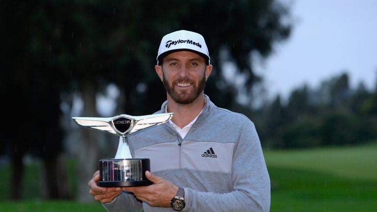 PACIFIC PALISADES, CA - FEBRUARY 19:  Dustin Johnson poses with the trophy during the final round at the Genesis Open at Riviera Country Club on February 1