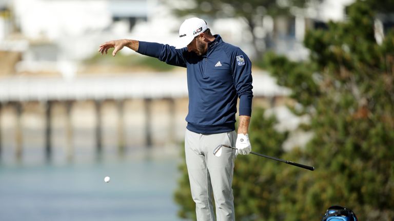 PEBBLE BEACH, CA - FEBRUARY 11:  Dustin Johnson takes a drop on the fifth hole during the Final Round of the AT&T Pebble Beach Pro-Am at Pebble Beach Golf 