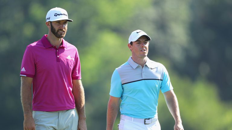 PONTE VEDRA BEACH, FL - MAY 12:  Dustin Johnson of the United States and Rory McIlroy of Northern Ireland walk on the 14th hole during the second round of 