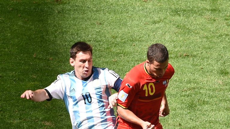 Argentina's forward Lionel Messi (L) vies with Belgium's forward Eden Hazard in the 2014 World Cup