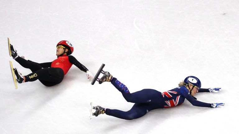 GANGNEUNG, SOUTH KOREA - FEBRUARY 17: Jinyu Li of China and Elise Christie of Great Britain fall during the Short Track Speed Skating Ladies' 1500m Semifin