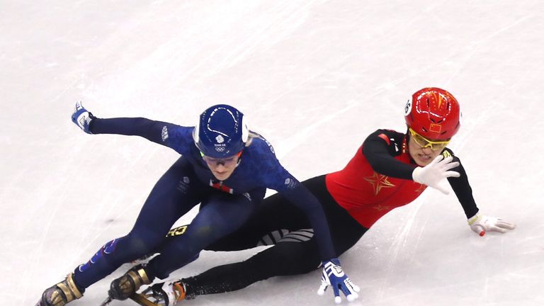 GANGNEUNG, SOUTH KOREA - FEBRUARY 17:  Jinyu Li of China and Elise Christie of Great Britain fall during the Short Track Speed Skating Ladies' 1500m Semifi