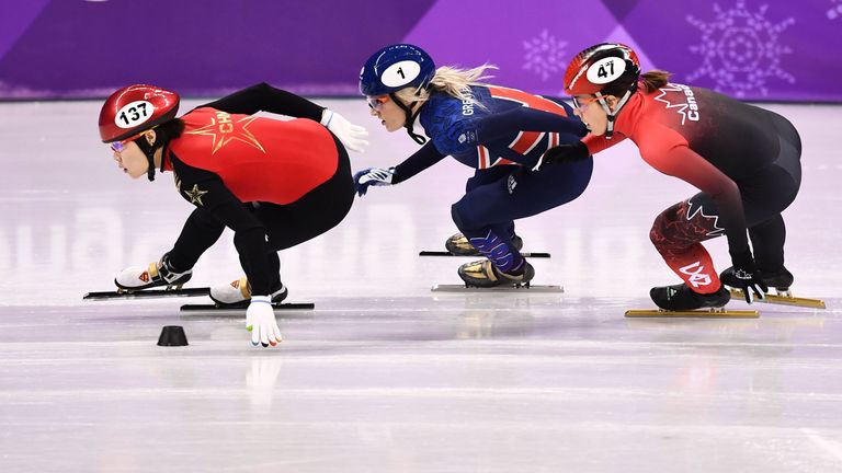 (L-R) China's Zhou Yang, Britain's Elise Christie and Canada's Valerie Maltais compete in the women's 1,500m short track speed skating heat event during th