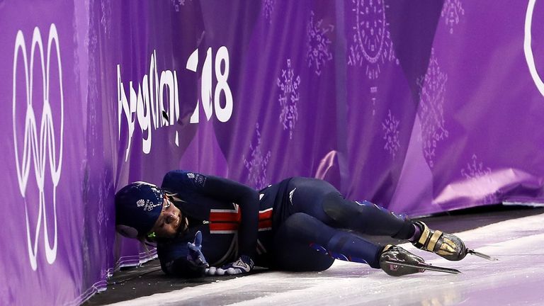 GANGNEUNG, SOUTH KOREA - FEBRUARY 17:  Elise Christie of Great Britain falls after a collision with Jinyu Li of China during the Short Track Speed Skating 