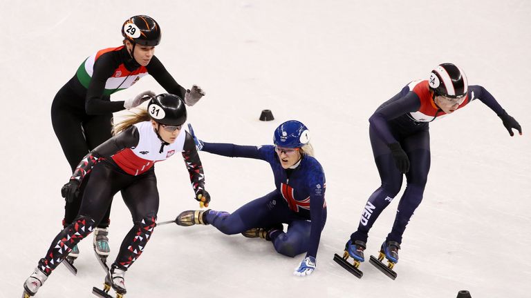 Elise Christie of Great Britain crashes out during the Ladies Short Track Speed Skating 1000m Heats on day eleven of