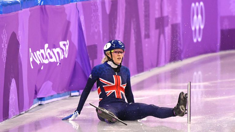 Elise Christie looks on after crashing out of the 500m short track final