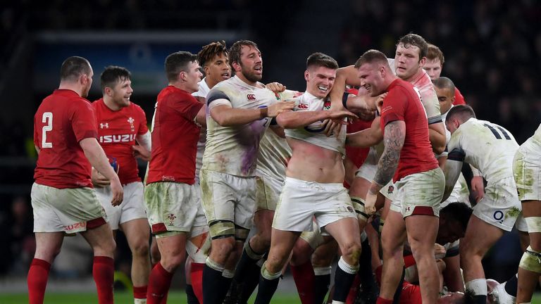 LONDON, ENGLAND - FEBRUARY 10:  Owen Farrell of England and Ross Moriarty of Walecs clash during the NatWest Six Nations round two match between England an