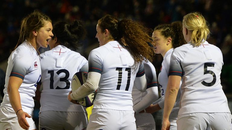 GLASGOW, SCOTLAND - FEBRUARY 23: Charlotte Pearce of England is congratulated by her team mates after scoring a try in the second half during the Natwest W