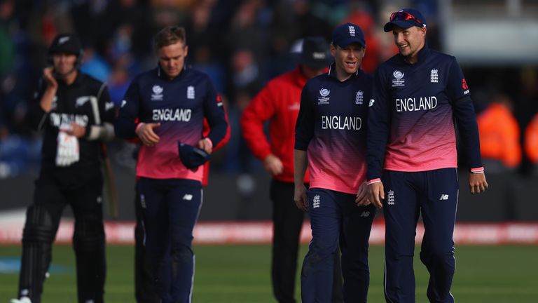England captain Eoin Morgan alongside Joe Root after clinching a 87 run victory and a place in the semi-final during the ICC Cha