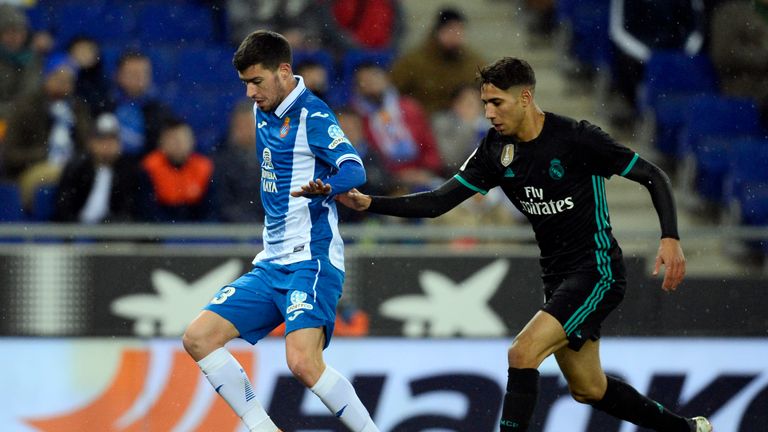Espanyol's Aron Martin (L) vies with Real Madrid's Achraf Hakimi