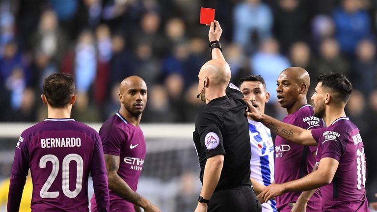 WIGAN, ENGLAND - FEBRUARY 19:  Fabian Delph of Manchester City is shown a red card by referee Anthony Taylor during the Emirates FA Cup Fifth Round match b