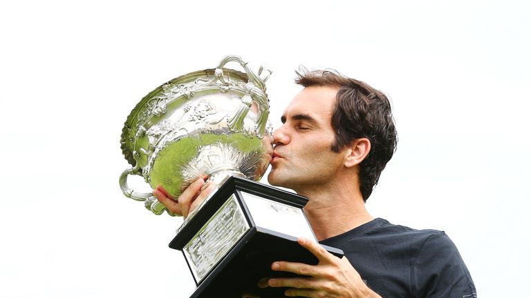 MELBOURNE, AUSTRALIA - JANUARY 29:  Roger Federer of Switzerland kisses the Norman Brookes Challenge Cup after winning the 2018 Australian Open Men's Singl