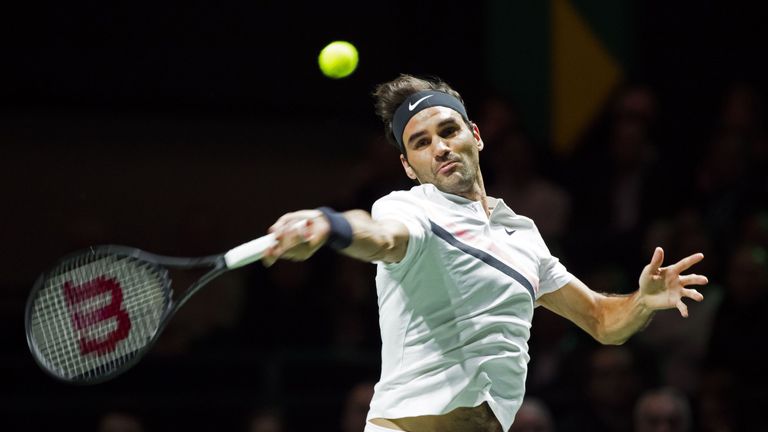Swiss tennis player Roger Federer of Switzerland jubilates returns a ball to Germany Philipp Kohlschreiber during their second round match of the ABN AMRO 