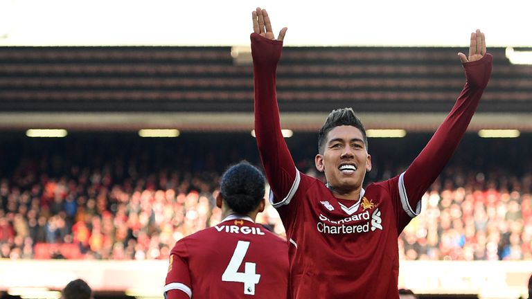 Roberto Firmino celebrates after making it 3-0