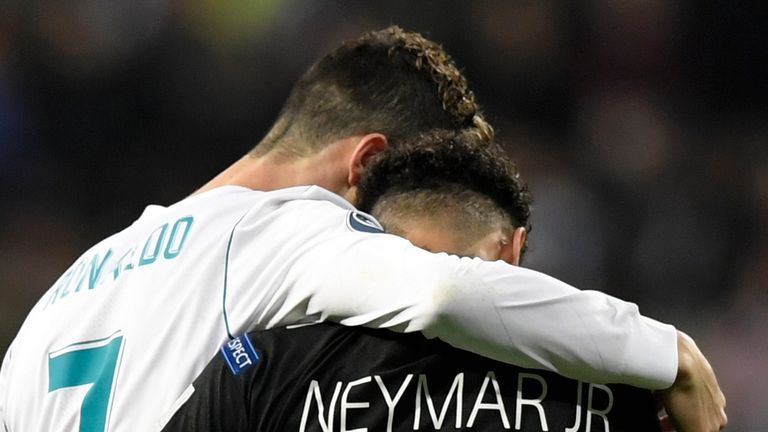 Cristiano Ronaldo embraces Neymar during the UEFA Champions League Round of 16 First Leg between Real Madrid and PSG