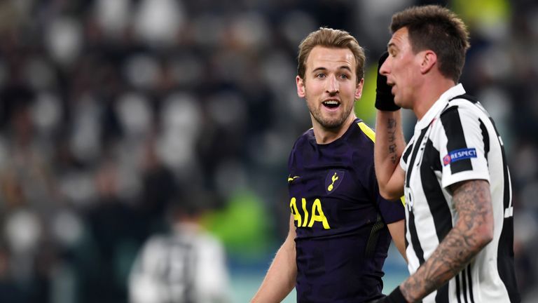 Harry Kane speaks with Mario Mandzukic during the UEFA Champions League Round of 16 match between Juventus and Tottenham Hotspur