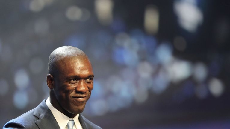 Clarence Seedorf arrives to take part in the UEFA Champions League Group stage draw ceremony on August 25, 2016